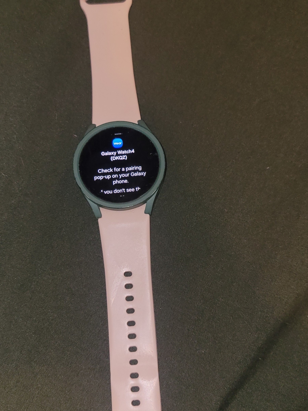 Samsung Galaxy Watch4 with Light Pink Silicone Band and Dark Green Case